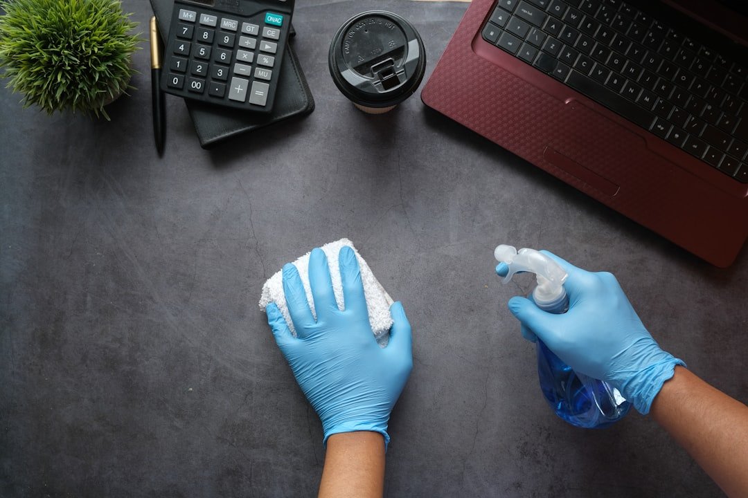 gallery-05 hands-cleaning-desk-with-spray-bottle-9gpkrsbgmc