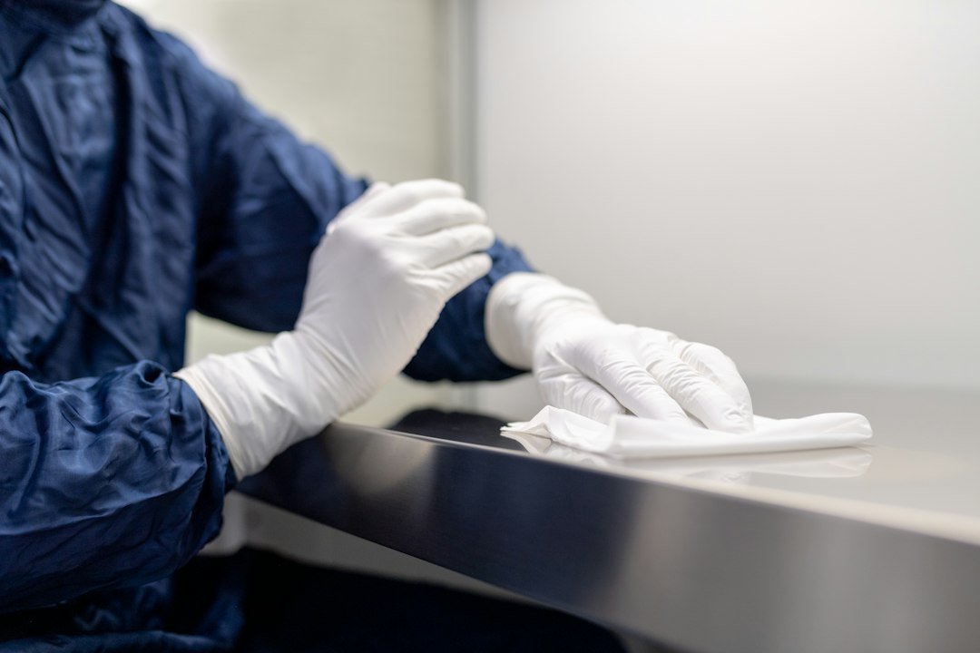 Laboratory personnel cleaning laboratory